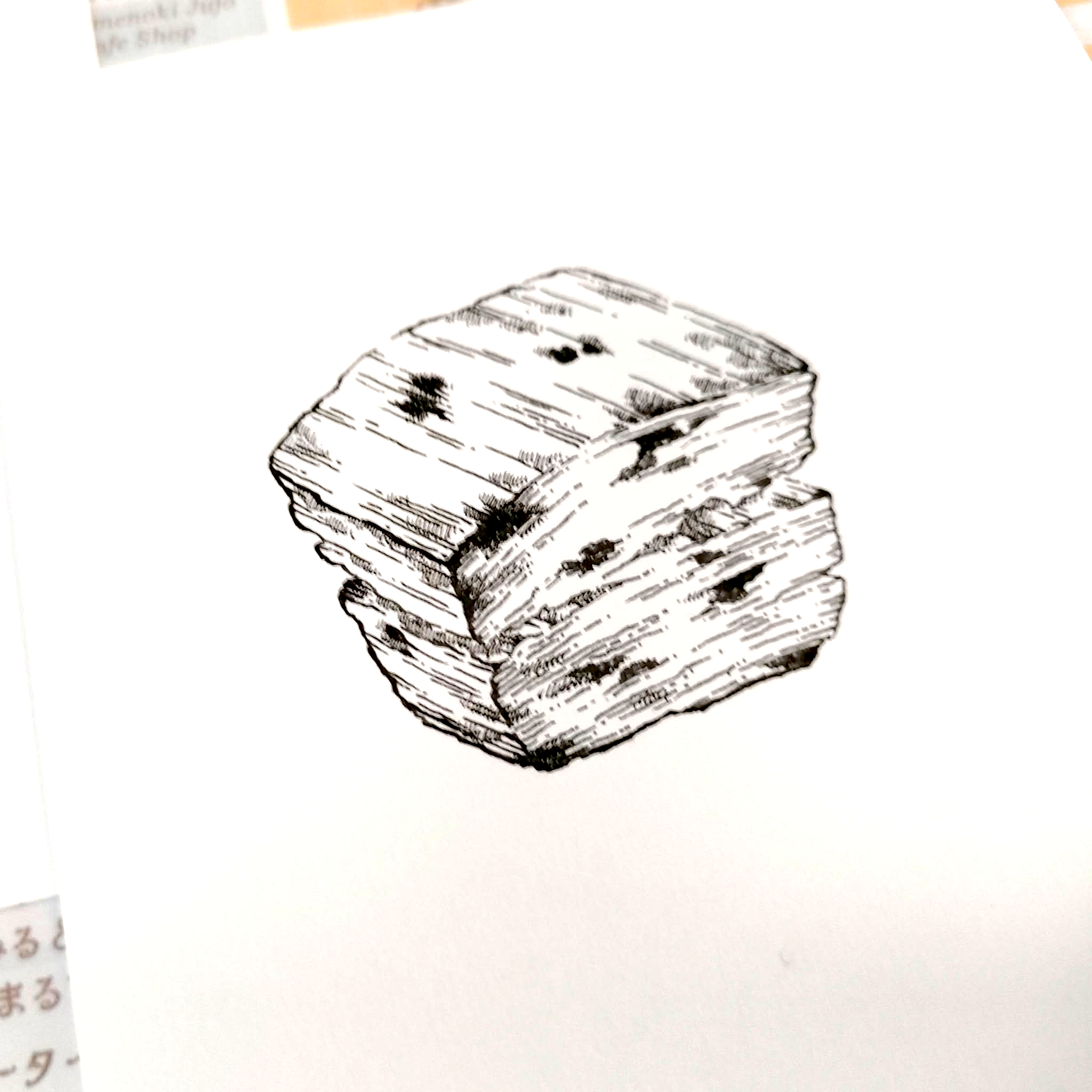 スコーンを描いたペン画の原画を撮影した画像です。